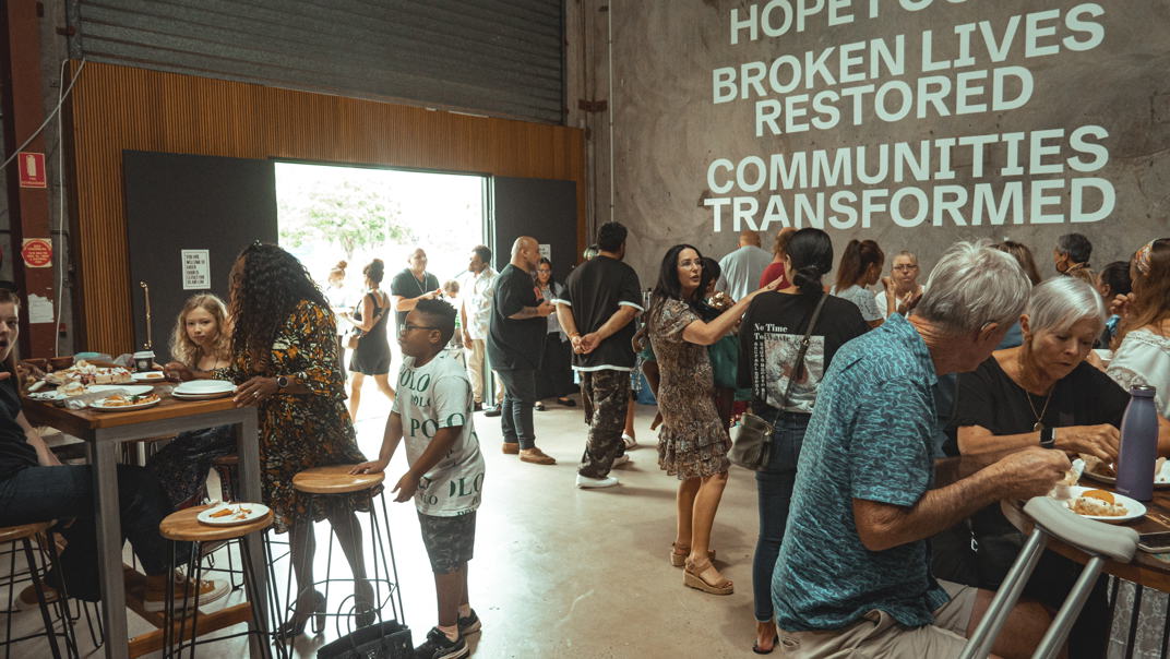 People gather at Majestic Church after the service in the foyer to talk and catch up.